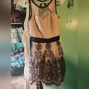 Pink dress with sheer high neck and organic black floral pattern